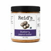 Jar of blueberry peanut butter n a white background