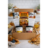 Reid’s Gourmet subscription box with one jar of honey and one jar of peanut butter and information cards in a gift box