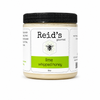 Jar of Reid's Gourmet lime whipped honey on a white background