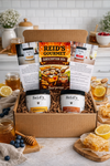 Reid’s Gourmet honey subscription box with two jars of honey and two informational cards in a gift box