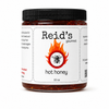 Jar of Reid's Gourmet hot honey on a white background