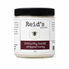 Jar of Reid's Gourmet immunity boost whipped honey on a white background