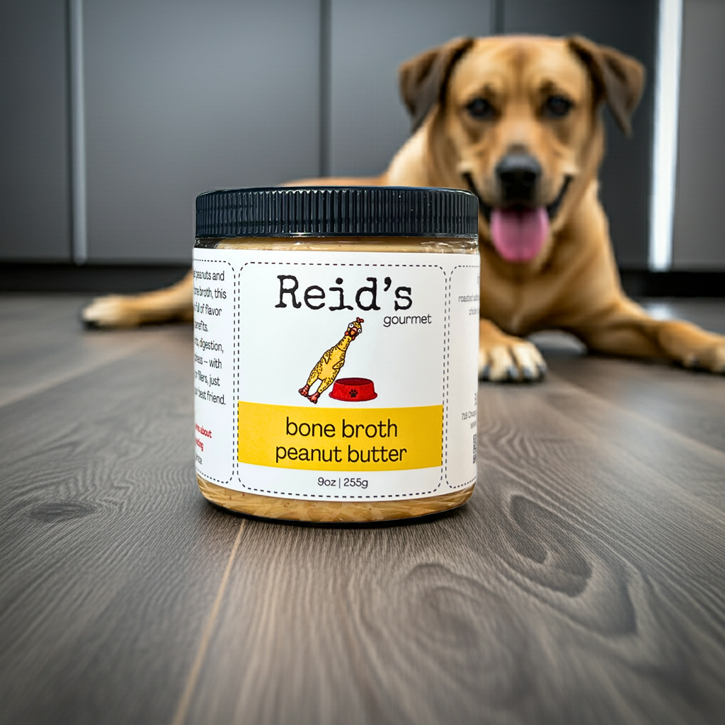 Jar of Reid's Gourmet bone broth peanut butter with a dog in the background