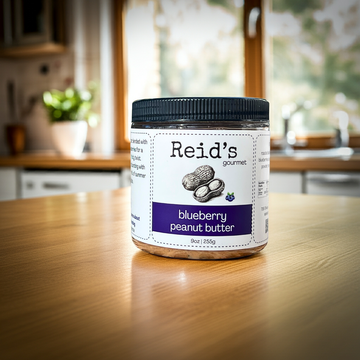 Jar of Reid's gourmet blueberry peanut butter on a kitchen counter