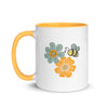 Bee In Bloom ceramic coffee mug with boho floral design and honeybee, white exterior and yellow interior
